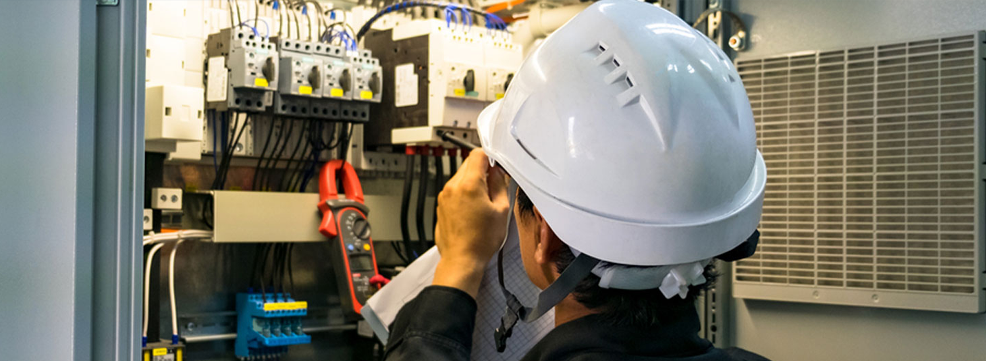 Anchor Electric technician performing electrical inspection in Sarasota